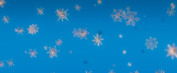 Winter Snowflakes Falling Against a Blue Sky