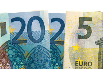 CLose up on 2025 written with euros bank notes, finances, earnings and budget concept