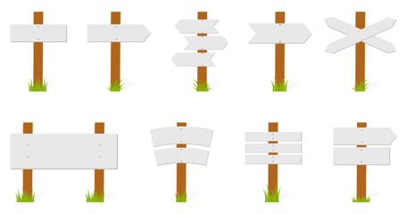 Wooden direction signpost with grass in a flat design © top dog