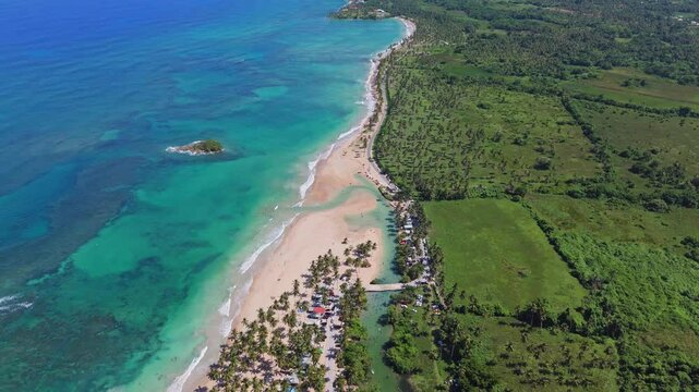 Playa entrada on Dominican republic during sunny day. Clear Caribbean Sea with sandy beach in exotic landscape. Drone top down.