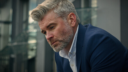 Close up sad upset worried frustrated stress pensive senior business man sorrowful thoughtful middle-aged old mature businessman employer take off glasses think problem solution thinking city outdoors