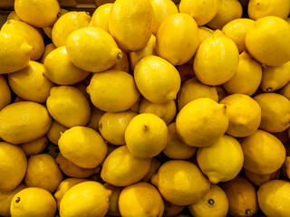Full frame yellow lemons as background