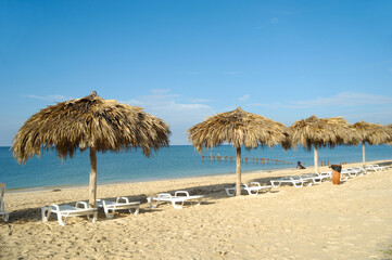 Beach with parasols and sunbeds