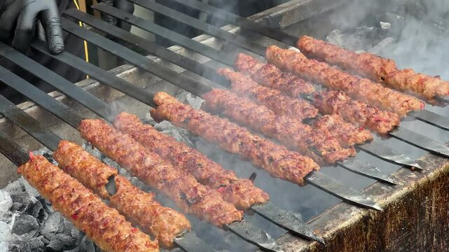  Turkish Kebab On The Grill. Barbecue grliling shish kebab , shish kebab in smoke over coal fire