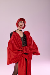 A vibrant drag queen showcases stunning fashion and confidence.