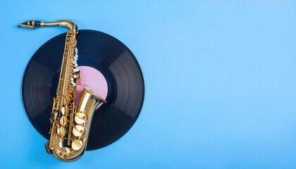 Naklejka premium Saxophone and vinyl record on blue background.