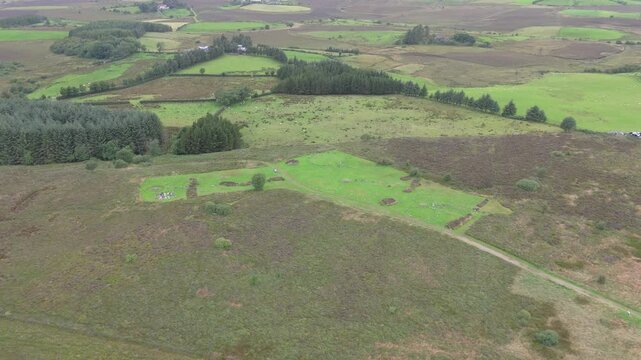 Aerial view of a group of women worshipping at the Beaghmore Stone circles at Blackrock Road by Cookstown in County Tyrone, Northern Ireland
