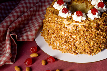 Royal cake. Crown. Garnished with candied cherry.