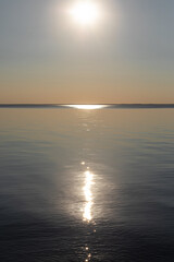 The sun shines on the sea horizon