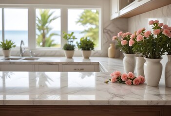 Fototapeta premium A marble kitchen counter with a vase of fresh flowers and a bonsai tree in the background, with a blurred beach scene visible through a window