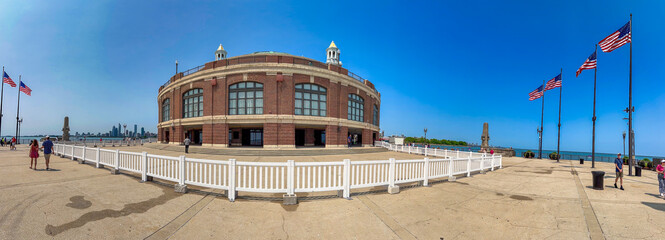 Chicago, IL - July 26, 2024: Tourists and locals relax at Navy Pier on a beautiful summer day. Panoramic view