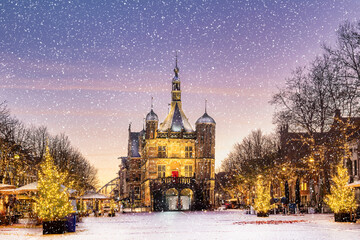 Winter view with snowfall in the ancient city center of Deventer, The Netherlands