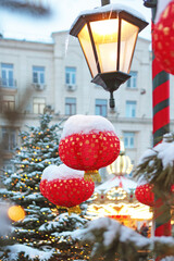 Chinese New Year. Red Chinese lanterns and snow. It's deserted. Vertical photo.