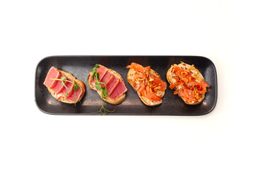 Bruschetta with salmon and tuna tartare on ciabatta toast isolated