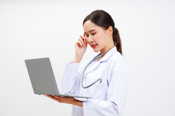 Asian female doctor standing smiling.