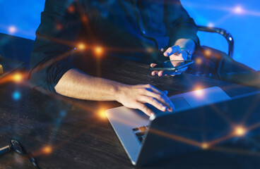 Close-up of male hands with laptop. Man is working remotely at home. Freelancer at work