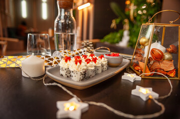 Sushi roll with cream cheese, sesame seeds and salmon caviar
