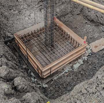Formwork with reinforcement bar for pad footing. Construction of pad footing foundation where the pads are used to support columns or structural framework within the superstructure.