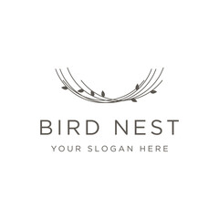 Obraz premium Simple bird's nest logo template design with twigs and leaves.