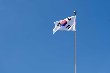 Flag of the Republic of Korea (South Korea) with blue sky background