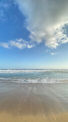 beach waves with clear skies