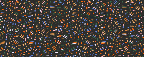 Colorful cute confetti seamless pattern with small stamp strokes. Hand drawn dashes, small lines and dots.