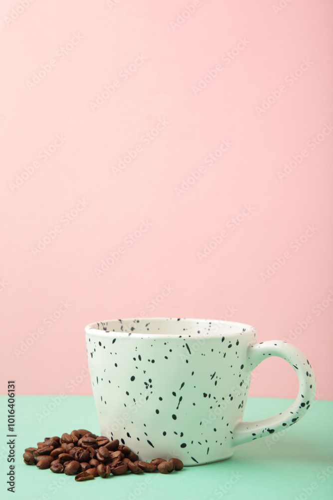 Poster coffee beans in white cups on pink background. top view