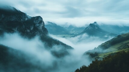 Fototapeta premium Misty Mountains Shrouded in Fog with a Valley Below
