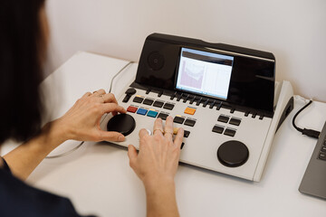 Operator working on medical diagnostic equipment, ideal for healthcare, technology, and medical use