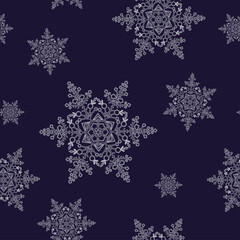 Seamless pattern with snowflakes on a blue background