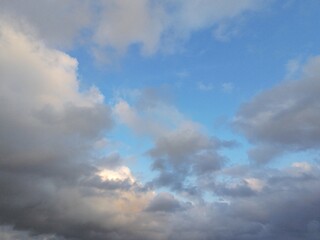 beautiful cloudy sky sunlight from the side, dramatic feel, it's going to rain