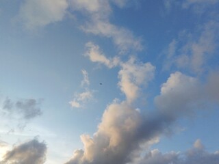 beautiful cloudy sky sunlight from the side, dramatic feel, it's going to rain