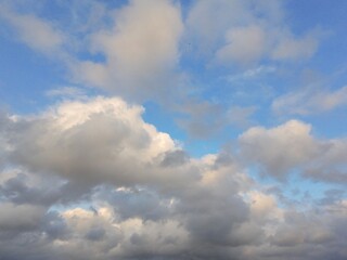beautiful cloudy sky sunlight from the side, dramatic feel, it's going to rain