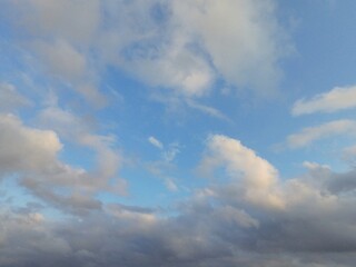 beautiful cloudy sky sunlight from the side, dramatic feel, it's going to rain