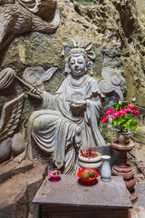 Fototapeta premium Buddhist temple with statues and sanctuary inside the Am Phu Cave in Marble Mountains in Da Nang in Vietnam