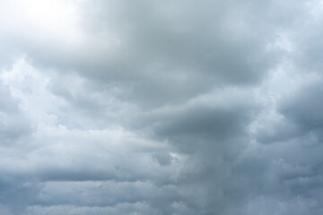 Dramatic cloudscape of white fluffy clouds against a deep blue sky