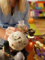 stacked crystals with oil bottles and candles on the table during kundalini opening energy