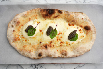 Pizza with truffle cheese and pita bread, top view