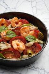Seafood salad with shrimps, tomatoes, mushrooms , olives and herbs