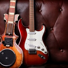 Naklejka premium Electric guitar on dark leather background