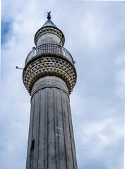 A view from below of the minaret against the sky.