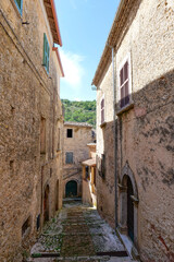 Fototapeta premium A street between the old houses of Casalvieri in Lazio, Italy.