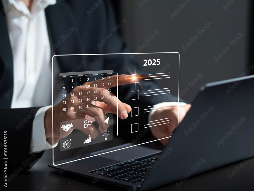 Fototapete businessman planning with checkbox and text 2025 on desk. text in virtual notebook 2025. new year id