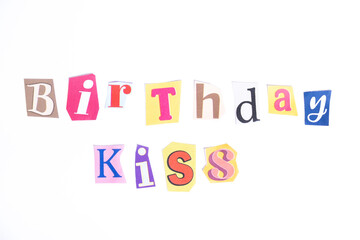 Happy Birthday symbol. Concept words Birthday Kiss isolated on clean white background in fun cut out newspaper style typescript. Concept birthday celebration.