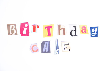 Happy Birthday symbol. Concept words Birthday  Cake isolated on clean white background in fun cut out newspaper style typescript. Concept birthday celebration.