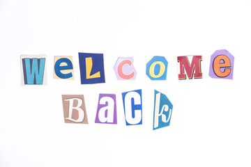 Welcome symbol. Concept words Welcome Back isolated on clean white background in fun cut out newspaper style typescript. 