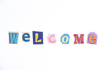 Welcome symbol. Concept words Welcome isolated on clean white background in fun cut out newspaper style typescript. 