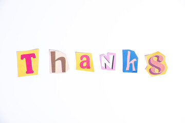Thank you symbol. Fun cut out newspaper style typescript with word Thanks. Isolated on clean white background. Gratitude and Thank you concept.