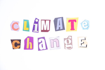 Phrase Climate Change spelled in cut out newspaper style typography isolated on white background.