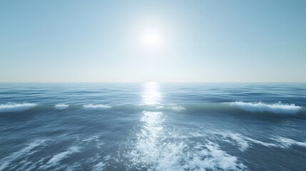 Obraz premium A calm ocean scene with gentle waves and a clear blue sky.